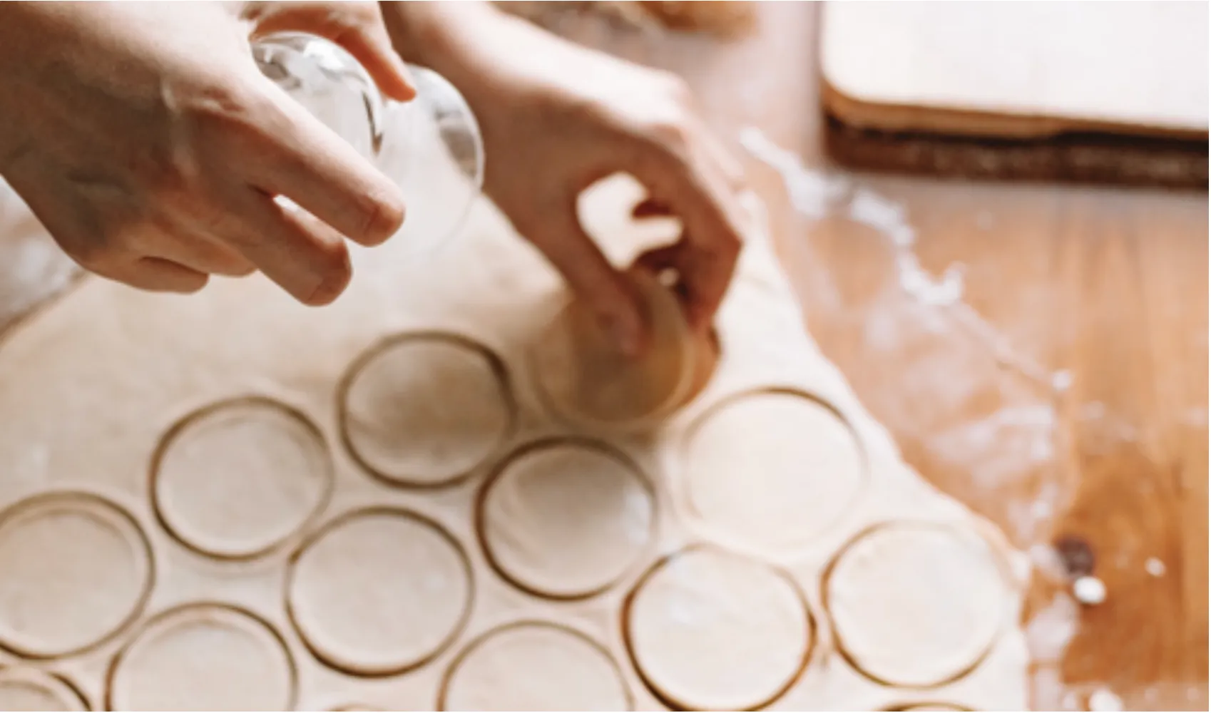 Cutting circles from rolled dough, arranged in offset rows